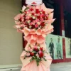 kệ hoa cẩm chướng đỏ Hồng Thắm Kiến Tạo